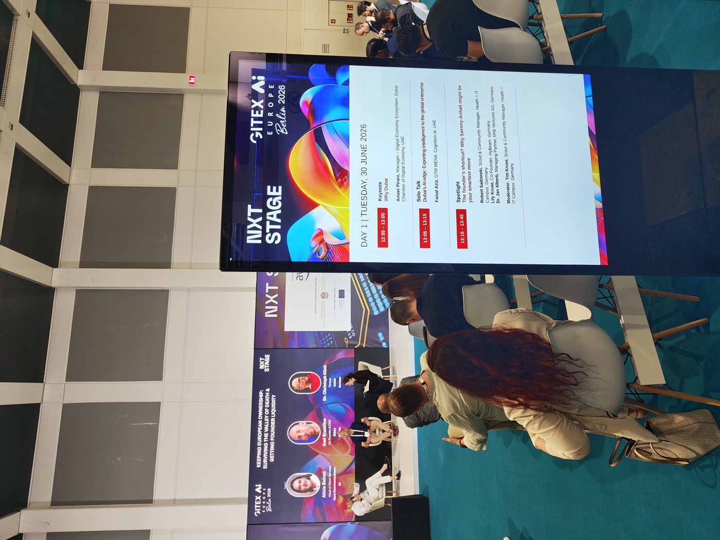 Stage screen showing the live agenda at the GITEX conference